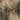 The image is a satellite view of a rugged, mountainous terrain with a mix of brown and gray colors, depicting a complex and intricate landscape.