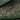 The image is a satellite view of a large, densely populated area with a mix of agricultural fields, roads, and other infrastructure.