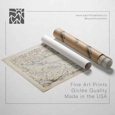 a map of the United States, along with a roll of paper and a tube of paper, all placed on a white background.