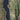 The image is a satellite view of a large body of water, likely a lake or river, surrounded by a densely populated area with fields and land.