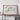 a large framed map of a region, likely a country or state, displayed on a wall above a wooden table.