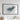 a large, framed map of Afghanistan hanging on a white wall.