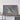 a large, framed map of Hawaii, with a wooden shelf below it.