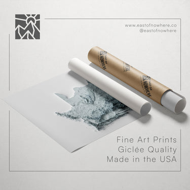 a roll of paper with a printed image of a wolf on it, along with a tube of paper and a text overlay promoting fine art prints made in the USA.