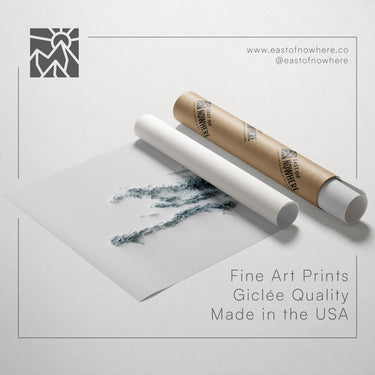a roll of paper with a drawing of a person's face on it, along with text promoting fine art prints and their quality.